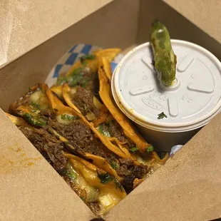 birria tacos, consomé in the side container