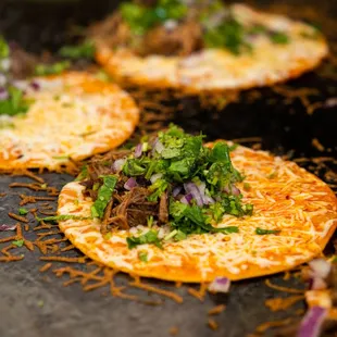 A closer look reveals the soul of our kitchen: our Quesabirria Tacos.