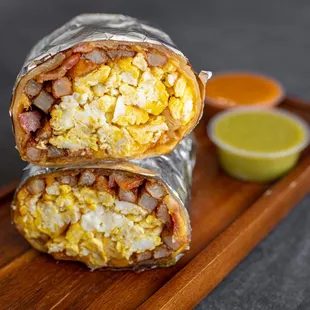 two burritos on a cutting board