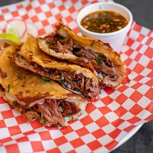 a plate of meat tacos