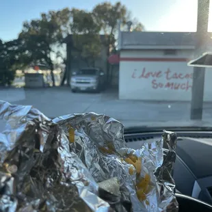 a hot dog wrapped in foil
