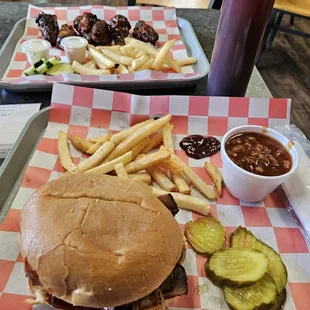 Brisket Sandwhich and fries. Spicy chicken wings and fries.