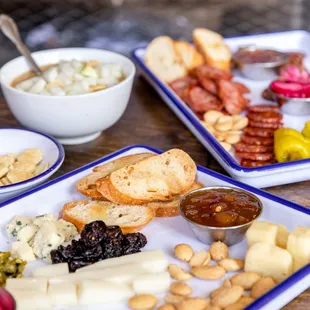 Charcuterie Plate: Assorted Meats from Gagliano&apos;s and Cheeses from Springside, featuring Farm Fresh Pickles and Jams.