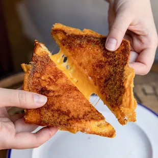 Springside Grilled Cheese: Springside Krakow, 4-year Aged Cheddar, and 1-year Aged Cheddar griddled on Sourdough.