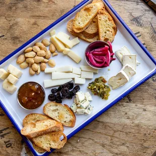 Charcuterie Plate: Assorted Meats from Gagliano&apos;s and Cheeses from Springside, featuring Farm Fresh Pickles and Jams.