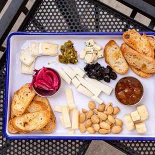 Charcuterie Plate: Assorted Meats from Gagliano&apos;s and Cheeses from Springside, featuring Farm Fresh Pickles and Jams.