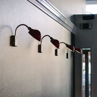 a row of lamps on a wall