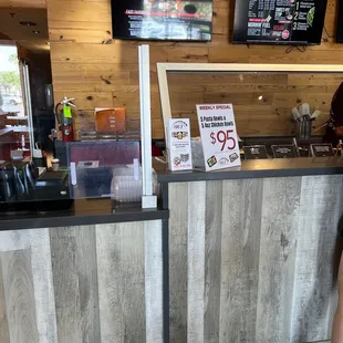 a woman standing in front of a counter