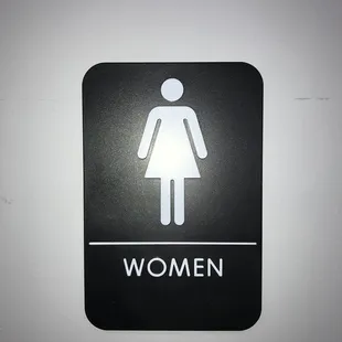 a women's restroom sign