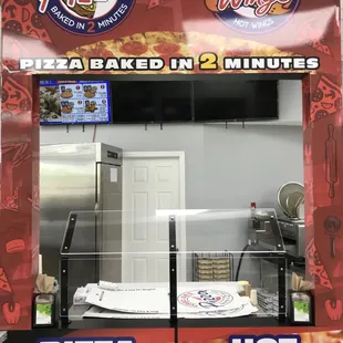 a pizza oven with a pizza on it