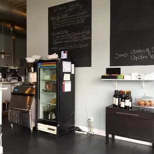 a coffee shop with a blackboard on the wall