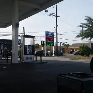 a gas station with a gas station sign