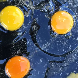 Angelo Farm's eggs (bottom left) versus store bought cage free &amp; organic egg.