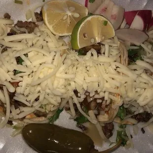 a plate of food with cheese and vegetables