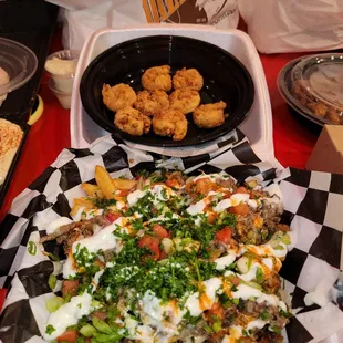 The best fries (middle eastern fries) ever! Way better than carne asada fries! The shrimp is from another place (the bag behind the shrimp).