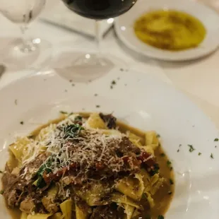 This dish was delish! It is pasta with short ribs with some tomatoes and spinach and cheese  grated over the top!