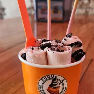 Strawberry rolled ice cream with pocky sticks