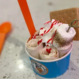 a cup of ice cream with marshmallows