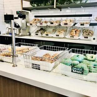 a counter with a variety of pastries