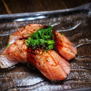 two pieces of salmon on a plate