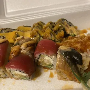 a close up of a container of sushi