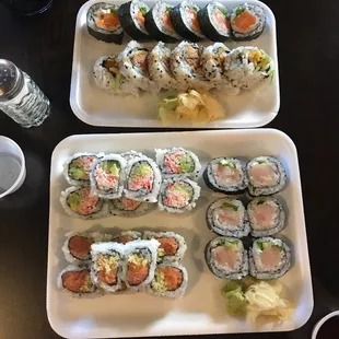 two plates of sushi on a table