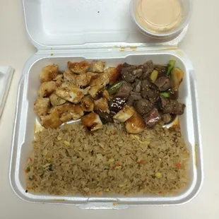 hibachi steak and chicken, to-go. generous portions of everything including the awesome sauce. :)