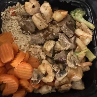 Teriyaki steak, chicken and shrimp with mushrooms, broccoli, and carrots