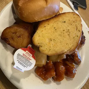 a plate of food with a donut and a bagel