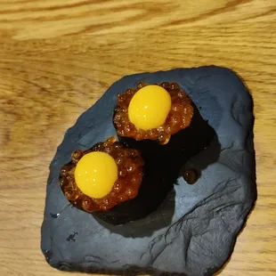 three eggs on a rock