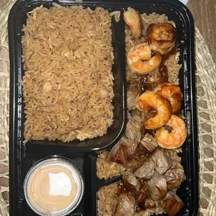 a tray of rice and shrimp
