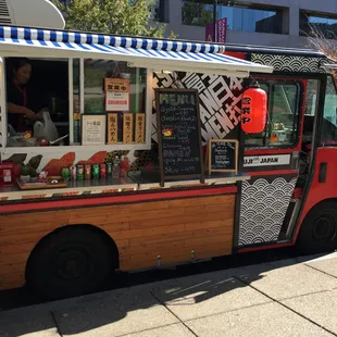 a food truck parked on the side of the road