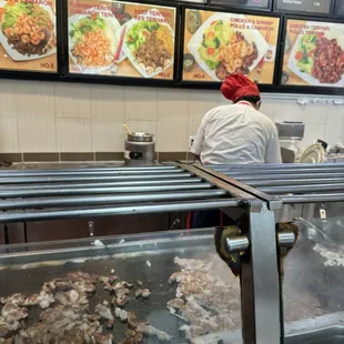 a chef preparing food in a restaurant kitchen