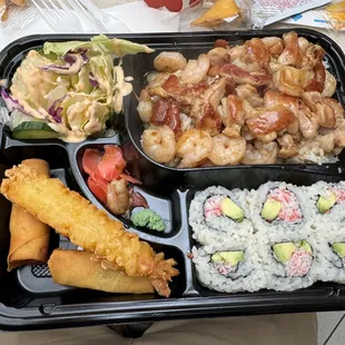 a bento box with a variety of food items