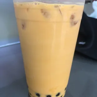 A picture of Thai tea with boba pearls. (1)