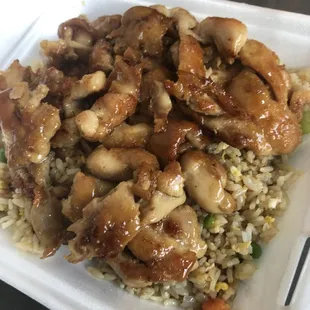 A picture of chicken and fried rice in a Styrofoam box. (2)