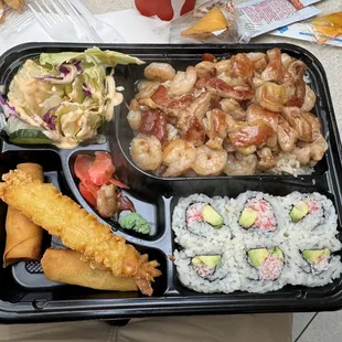 a bento box with a variety of food items
