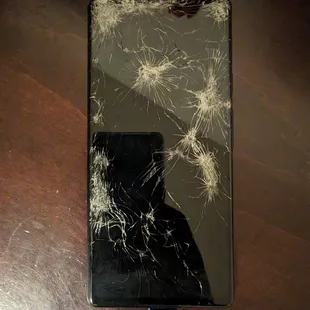 a broken cell phone on a table