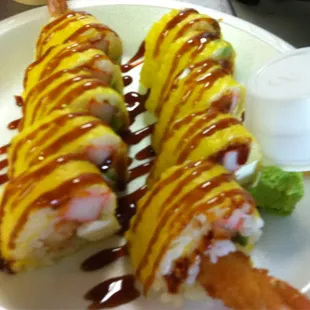 a plate of sushi rolls