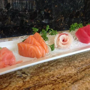 Salmon, whitefish, and tuna sashimi.