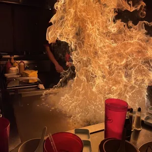 a man cooking in a large kitchen