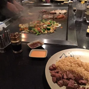 Everything prepared right before your eyes. Notice the sexy sauce sitting there (the orange sauce) it&apos;s one of my favorites haha