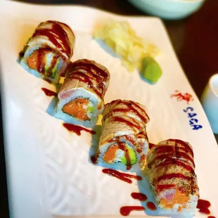 a plate of sushi rolls