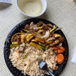 a plate of rice and vegetables