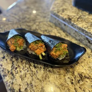 Spicy salmon hand rolls. I asked for extra spicy with avocado.