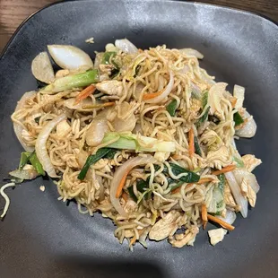 a plate of noodles and vegetables