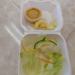Side salad $2.50. Barely any lettuce. 2 rotten pieces Stick with rice