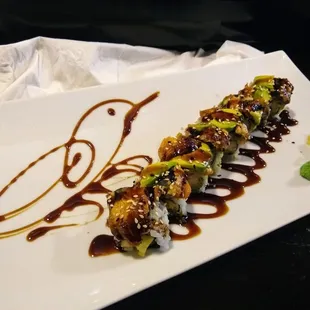 Green Dragon roll, with a cute bird drawn with the sauce.