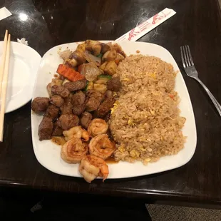 a plate of food with chopsticks