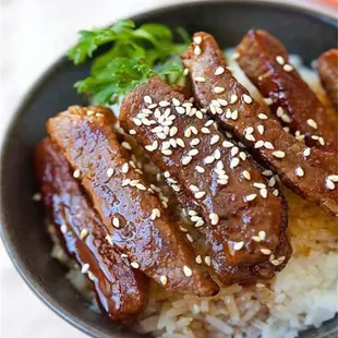 a bowl of rice and meat